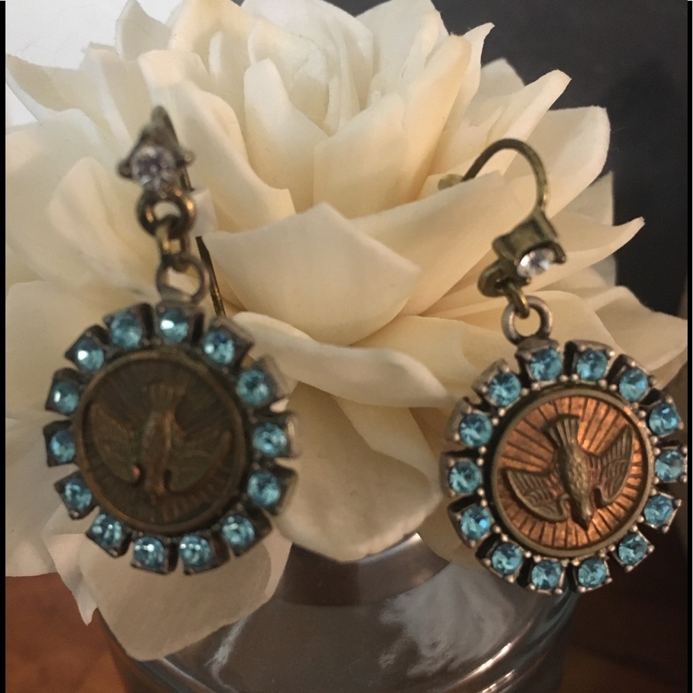 Dove coin earrings with blue accent crystals.